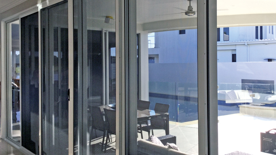 Security sliding doors opening to an outdoor entertaining area